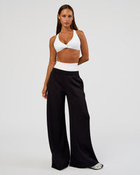 Woman wearing Aspire Twist Sports Bra - White | Model:Brylee | Size:XS
