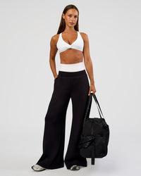 Woman wearing Aspire Twist Sports Bra - White | Model:Brylee | Size:XS