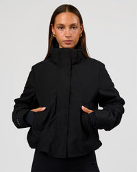 Woman wearing Auxiliary 2.0 Jacket - Black | Model:Brylee | Size:XS