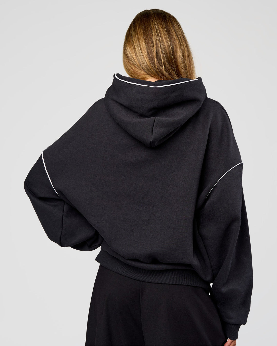 Woman wearing Axis Oversized Hoodie - Caviar-White | Model:Georgia | Size:XS