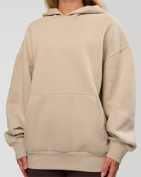 Woman wearing Base Oversized Hoodie - Shale Beige | Model:Issy | Size: XS |