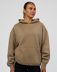 Woman wearing Base Oversized Hoodie - Taupe Ash | Model:Maja | Size:XS