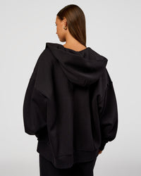 Woman wearing Base Zip Through Oversized Hoodie - Black | Model:Brylee | Size:XS