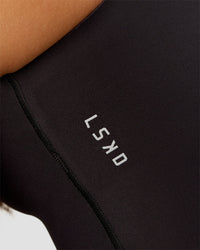 Woman wearing Bend & FLX Plunge Tank - Black | Model:Brylee | Size:XS