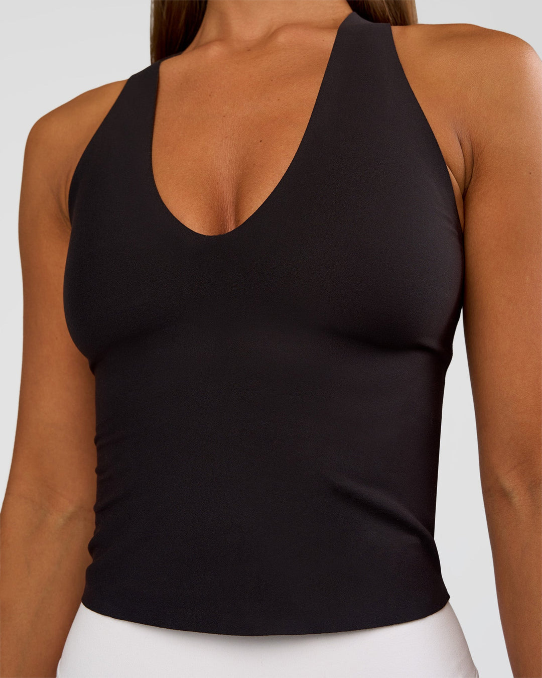 Woman wearing Bend &amp; FLX Plunge Tank - Black | Model:Brylee | Size:XS