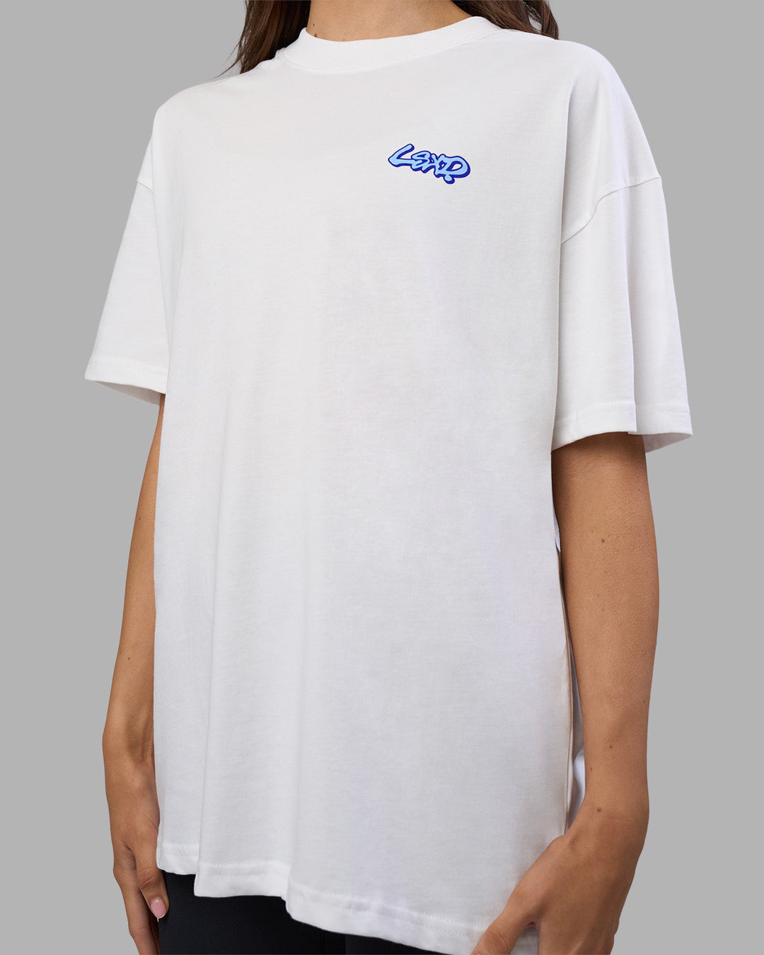 Woman wearing Break Through Heavyweight Oversized Tee - White-Power Cobalt | Model:Phoebe | Size:XS