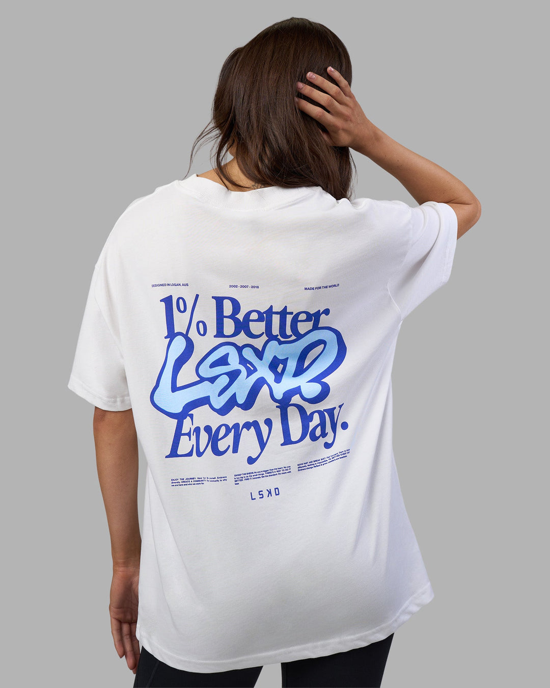 Woman wearing Break Through Heavyweight Oversized Tee - White-Power Cobalt | Model:Phoebe | Size:XS