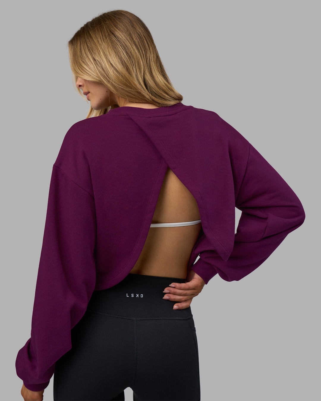 Woman wearing Breeze Open Back Sweater - Plum Caspia-Plum Caspia | Model:Leilani | Size:XS