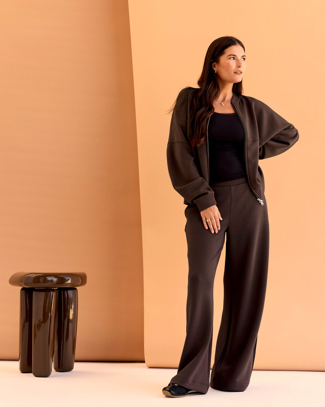 Woman wearing CF Elevate SoftTouch Bomber - Hot Chocolate | Model:Chloe | Size:XS