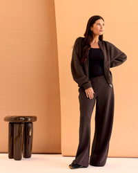 Woman wearing CF Elevate SoftTouch Bomber - Hot Chocolate | Model:Chloe | Size:XS
