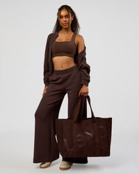 Woman wearing CF Elevate SoftTouch Bomber - Hot Chocolate | Model:Jordan | Size:XS