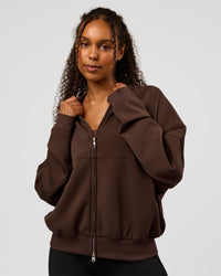 Woman wearing CF Elevate SoftTouch Bomber - Hot Chocolate | Model:Jordan | Size:XS