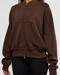 Woman wearing CF Elevate SoftTouch Bomber - Hot Chocolate | Model:Jordan | Size:XS