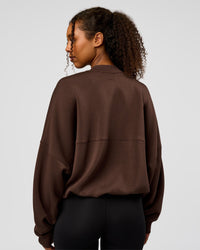 Woman wearing CF Elevate SoftTouch Bomber - Hot Chocolate | Model:Jordan | Size:XS