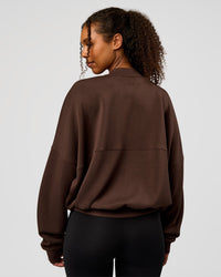 Woman wearing CF Elevate SoftTouch Bomber - Hot Chocolate | Model:Jordan | Size:XS