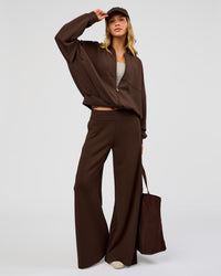 Woman wearing CF Elevate SoftTouch Bomber - Hot Chocolate | Model:Leilani | Size:XS