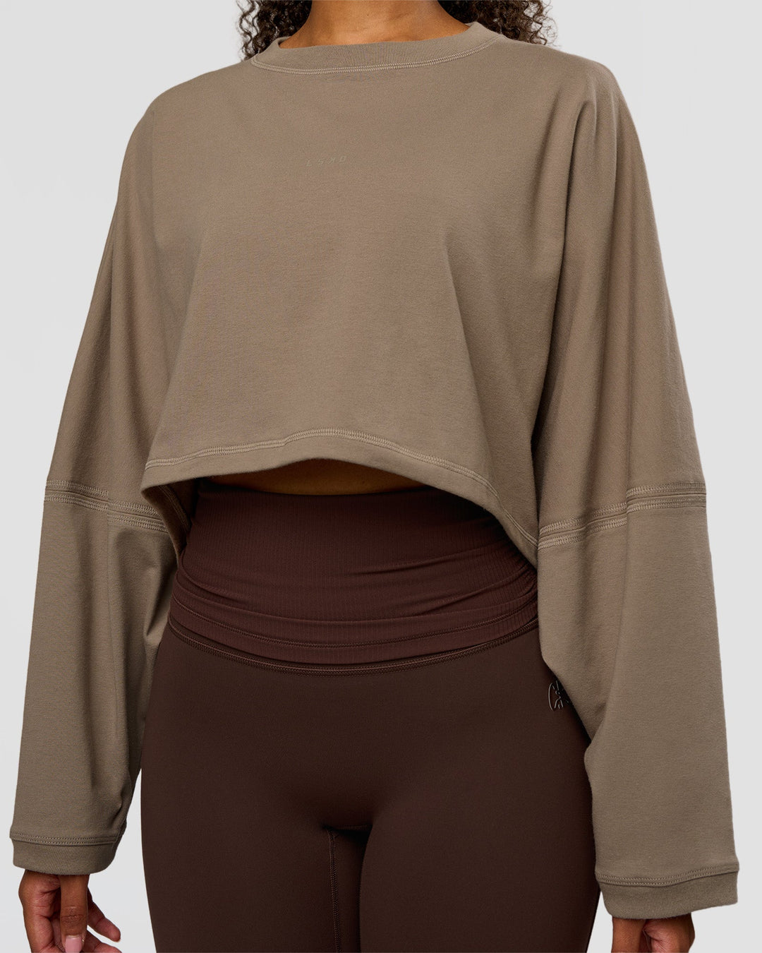 Woman wearing CF Street Surge Long Sleeve Tee - Taupe Ash | Model:Jordan | Size:XS