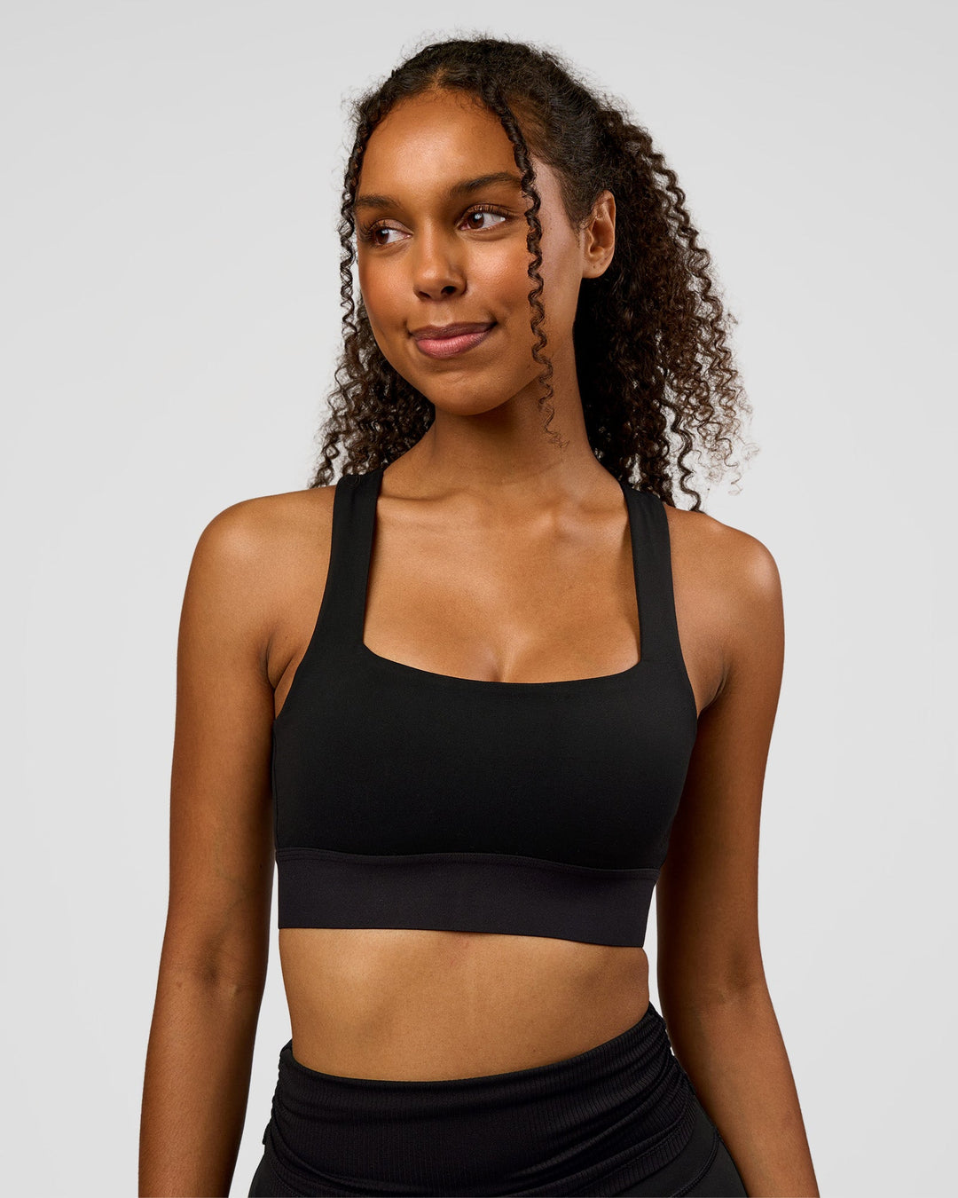 Woman wearing CF Train Hard Sports Bra - Black | Model:Jordan | Size:XS