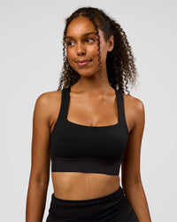 Woman wearing CF Train Hard Sports Bra - Black | Model:Jordan | Size:XS