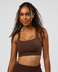 Woman wearing CF Train Hard Sports Bra - Hot Chocolate | Model:Jordan | Size:XS