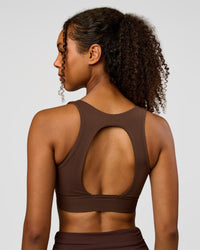 Woman wearing CF Train Hard Sports Bra - Hot Chocolate | Model:Jordan | Size:XS