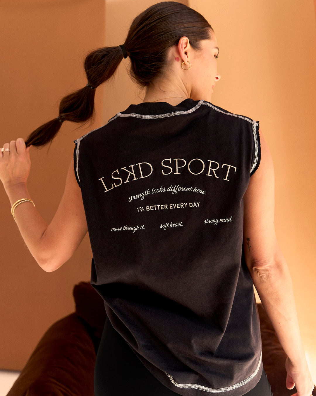 Woman wearing CF Unisex Oversized Heavyweight Boxed Tank - Black-CF X LSKD Sport | Model:Chloe | Size:XS