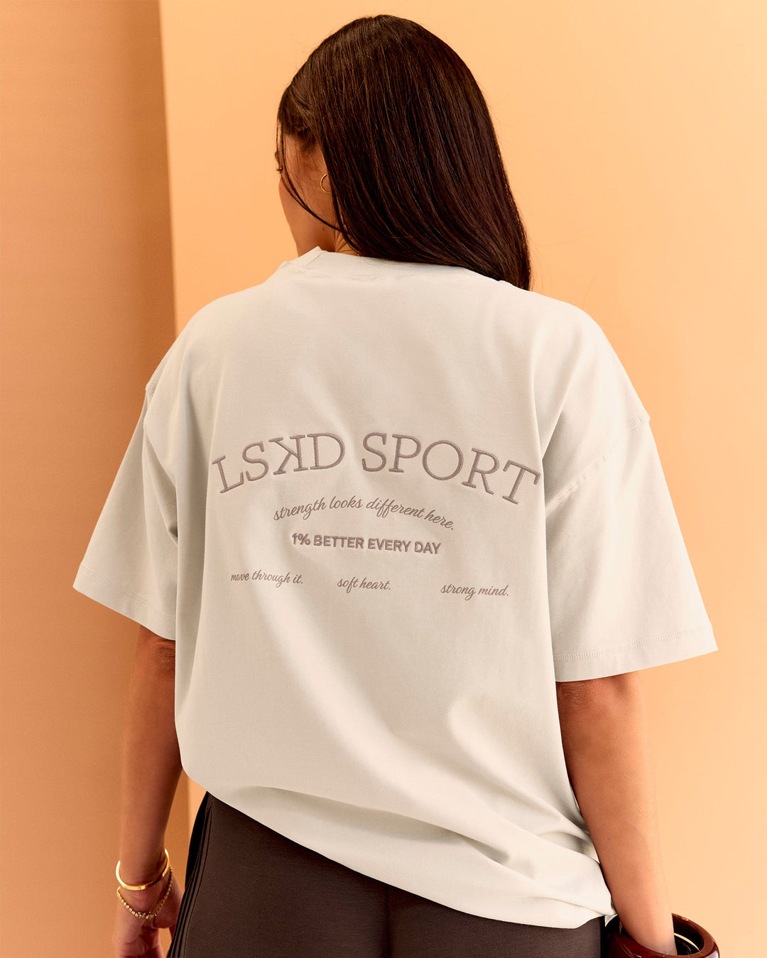 Woman wearing CF Unisex Oversized Heavyweight FLXCotton Tee - Clay-CF X LSKD Sport | Model:Chloe | Size:XS