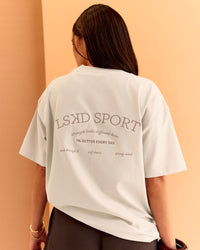 Woman wearing CF Unisex Oversized Heavyweight FLXCotton Tee - Clay-CF X LSKD Sport | Model:Chloe | Size:XS