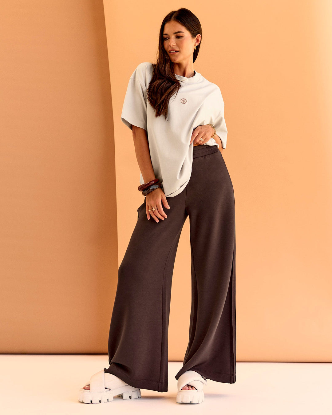 Woman wearing CF Unisex Oversized Heavyweight FLXCotton Tee - Clay-CF X LSKD Sport | Model:Chloe | Size:XS