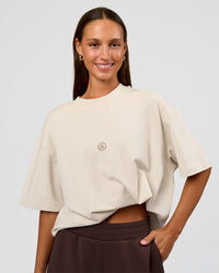 Woman wearing CF Unisex Oversized Heavyweight FLXCotton Tee - Clay-CF X LSKD Sport | Model:Brylee | Size:XS