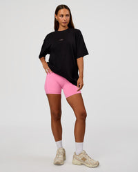 Woman wearing CFT BNE 26 FLXCotton Oversized Tee in Black | Model:Brylee | Size:XS