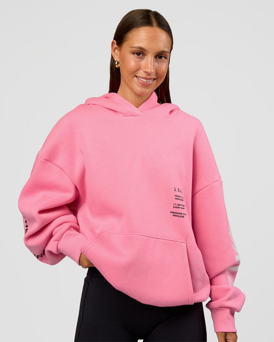 Woman wearing CFT BNE 26 Unisex Oversized Hoodie - Candy Pink-Black | Model:Brylee | Size:XS
