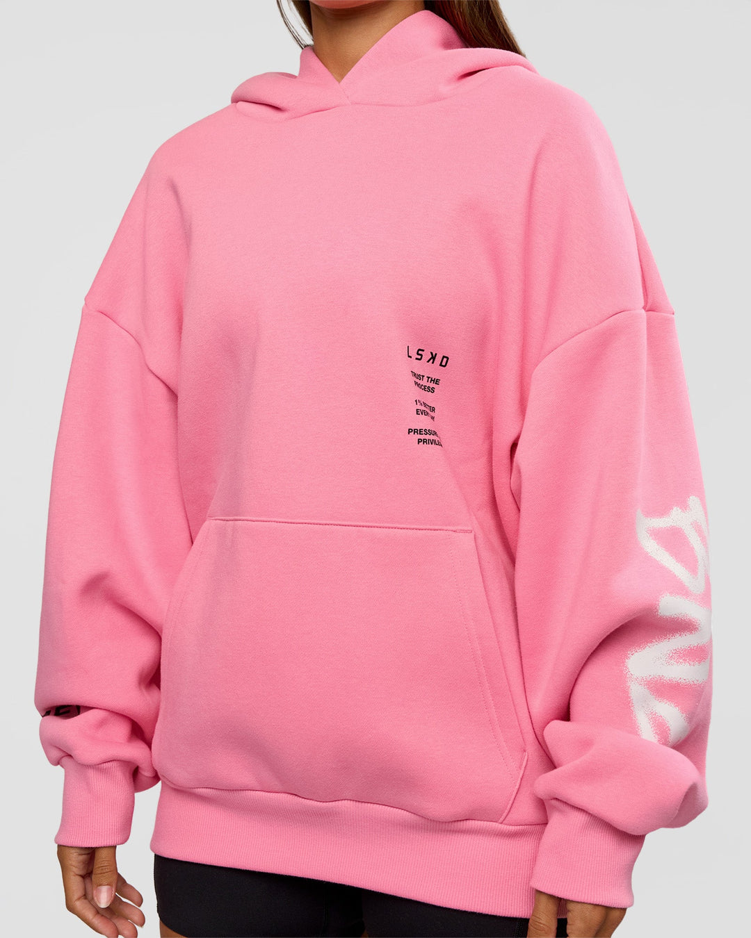 Woman wearing CFT BNE 26 Unisex Oversized Hoodie - Candy Pink-Black | Model:Brylee | Size:XS