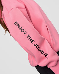 Woman wearing CFT BNE 26 Unisex Oversized Hoodie - Candy Pink-Black | Model:Brylee | Size:XS