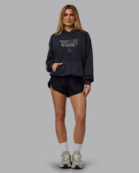 Woman wearing Chrome Washed Oversized Hoodie - Black | Model:Emilie | Size:XS