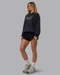 Woman wearing Chrome Washed Oversized Hoodie - Black | Model:Emilie | Size:XS