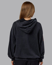 Woman wearing Chrome Washed Oversized Hoodie - Black | Model:Emilie | Size:XS