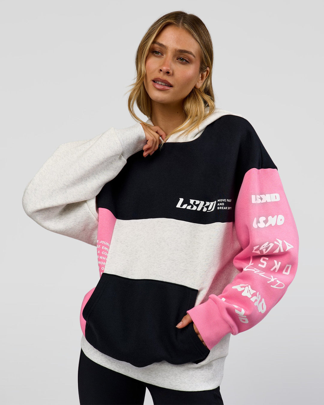 Woman wearing Deconstructed Fleece Hoodie - Caviar-Candy Pink-Grey Marl | Model:Leilani | Size:XS