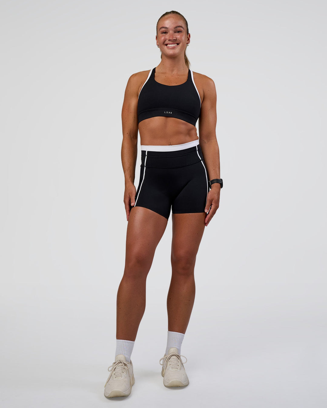 Woman wearing Distinction Sports Bra 2.0 - Black-White | Model:Sav | Size:XS