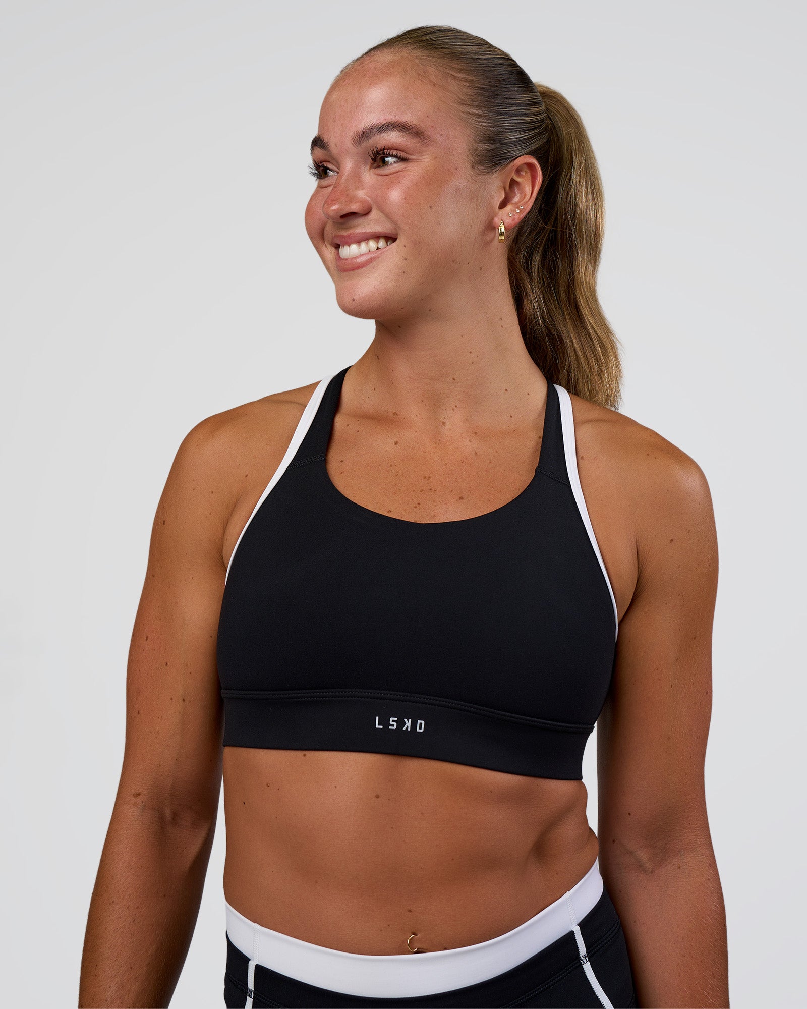 Woman wearing Distinction Sports Bra 2.0 - Black-White | Model:Sav | Size:XS