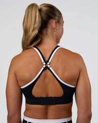 Woman wearing Distinction Sports Bra 2.0 - Black-White | Model:Sav | Size:XS