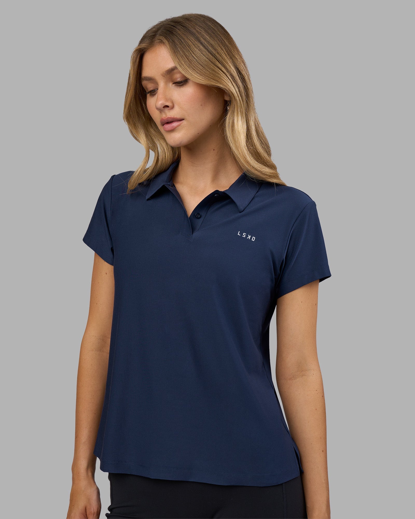 Woman wearing Drive Polo - Future Navy | Model:Leilani | Size:XS