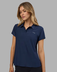 Woman wearing Drive Polo - Future Navy | Model:Leilani | Size:XS