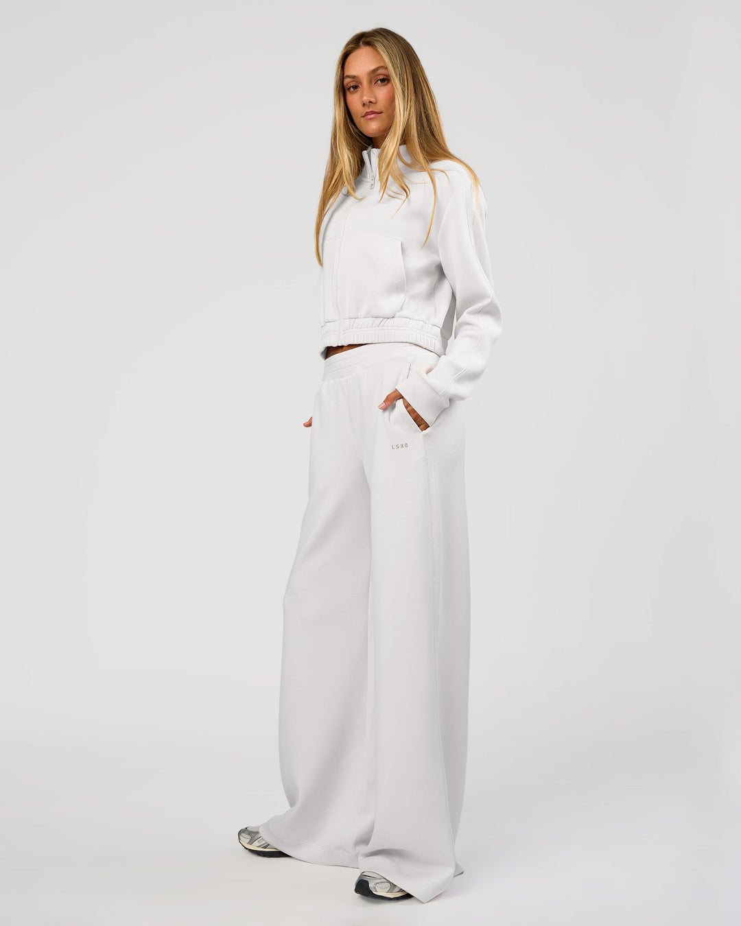 Woman wearing Elevate SoftTouch Wide Leg Pant Tall - Clay | Model:Georgia | Size:XS