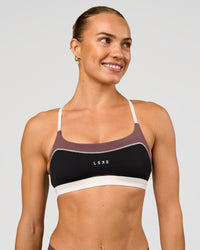 Man wearing Elevate Sports Bra - Black-Multi | Model:Maja | Size:XS