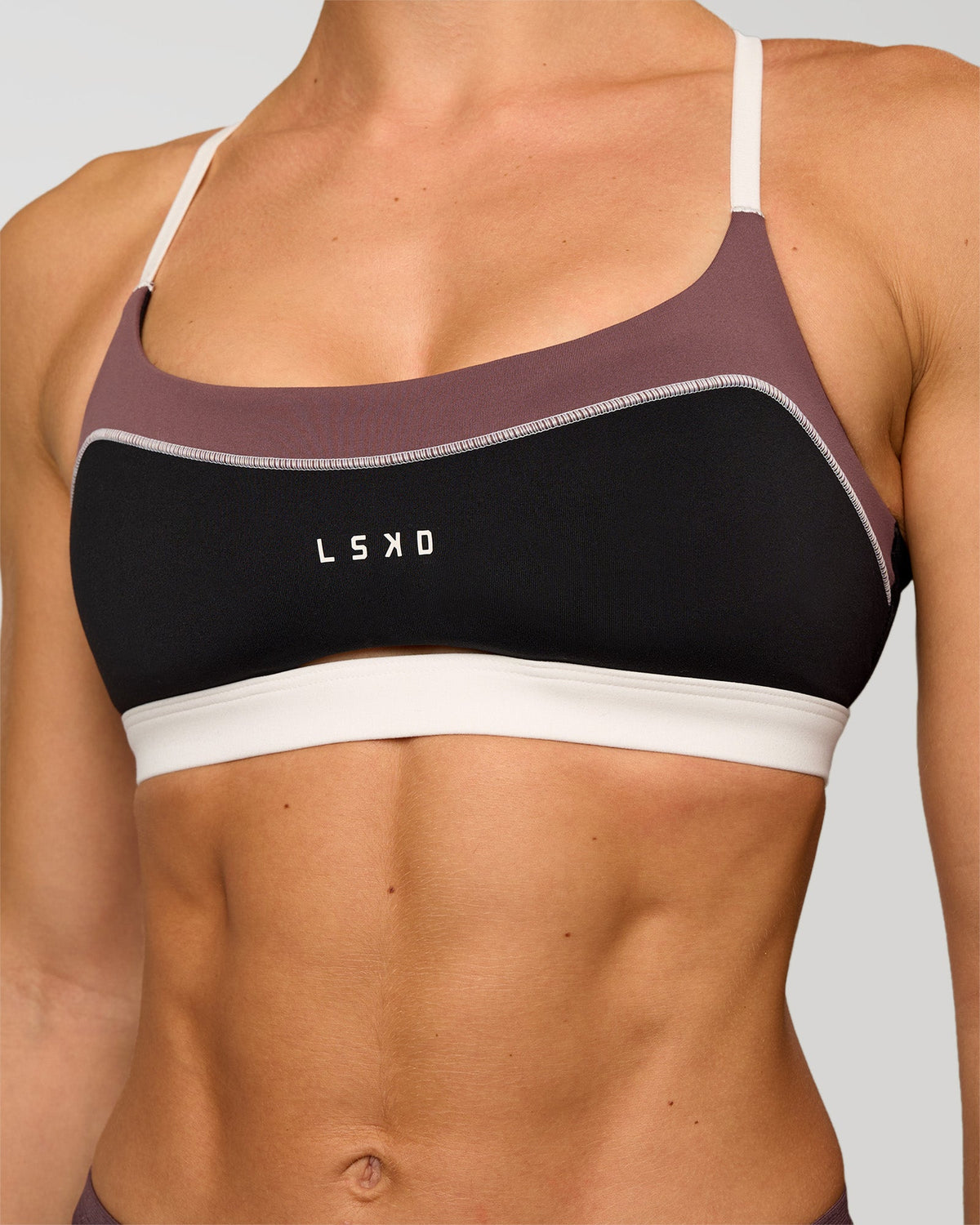 Man wearing Elevate Sports Bra - Black-Multi | Model:Maja | Size:XS - view 1