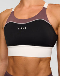 Woman wearing Elevated Accelerate Sports Bra - Black-Multi | Model:Maja | Size:XS