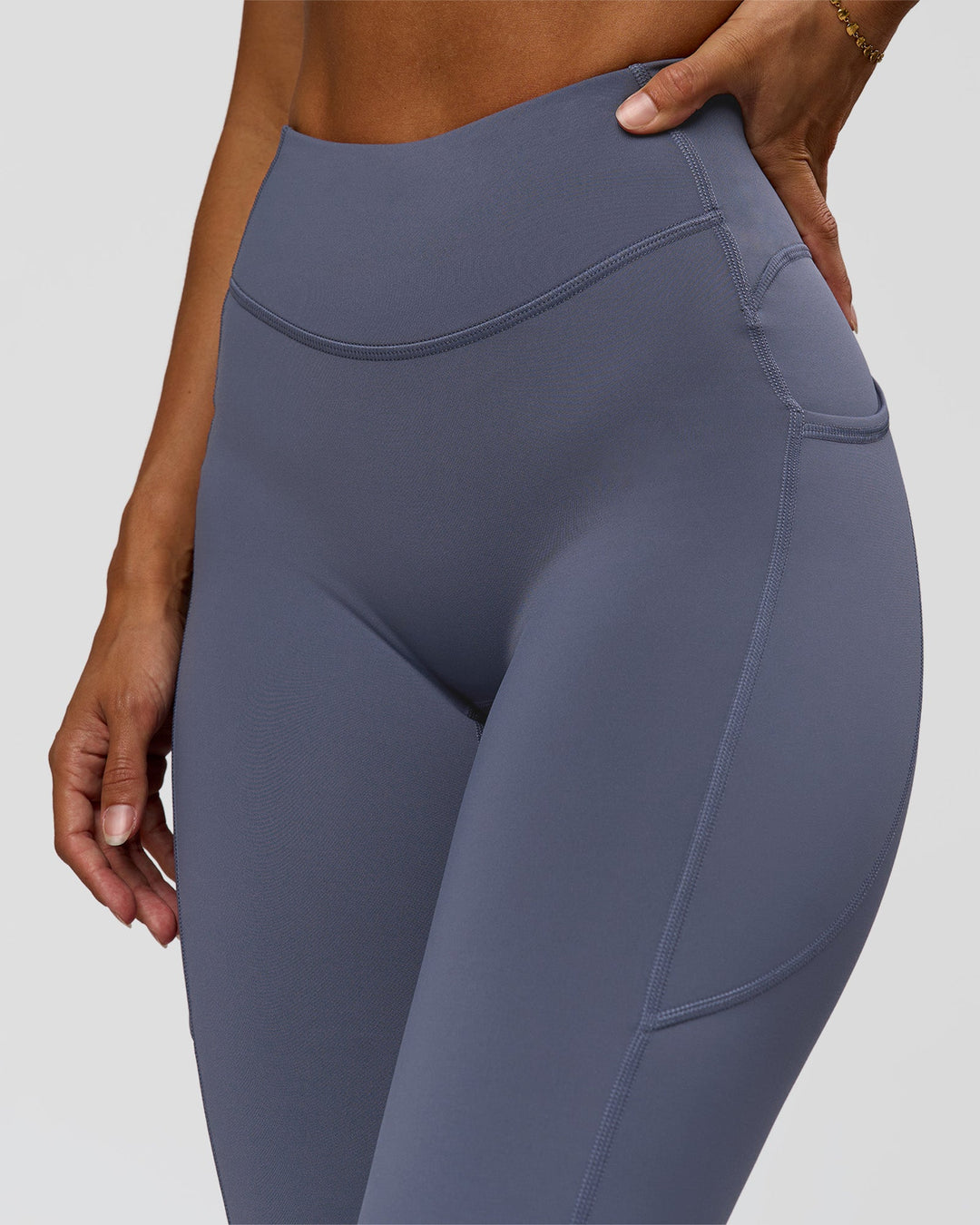 Woman wearing Elite Run High-Rise Full Length Legging Pockets - Night Shadow | Model:Brylee | Size:XS