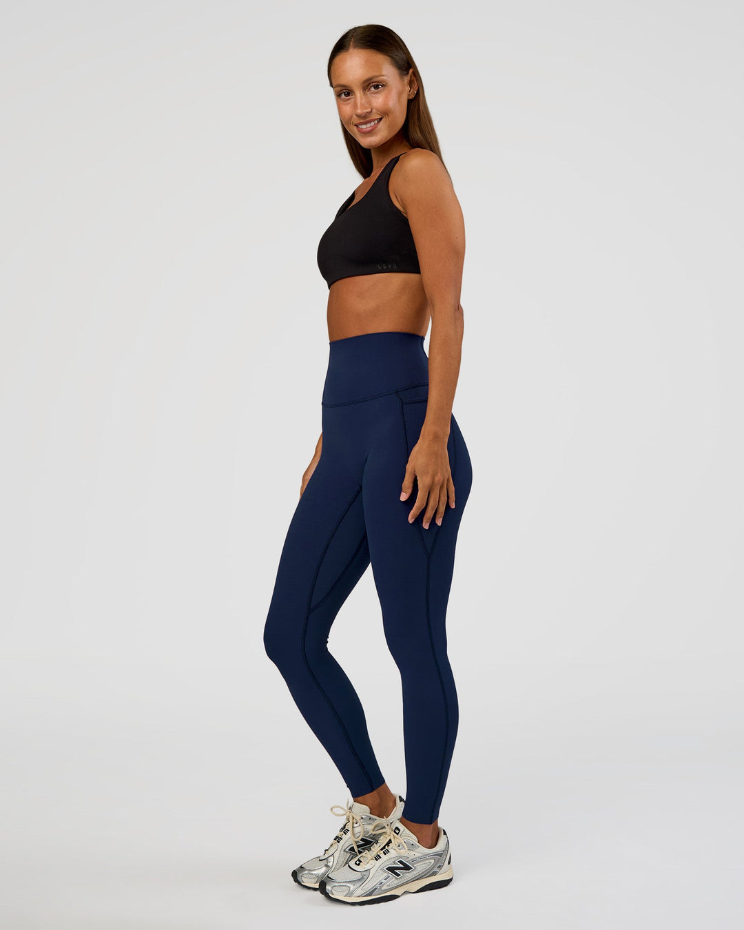 Woman wearing Elixir Ultra High-Rise Full Length Legging Pockets - Future Navy | Model:Brylee | Size:XS