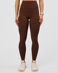 Woman wearing Elixir Ultra High-Rise Full Length Legging Pockets - Hot Chocolate | Model:Maja | Size:XS